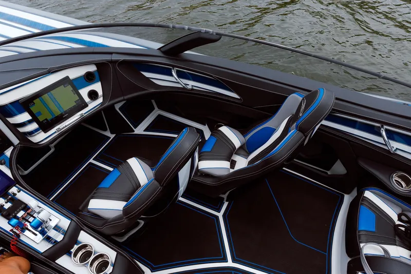 Slide: The Image of 2024 MTI 440X boat interior with modern dashboard and sleek seating design. - 26
