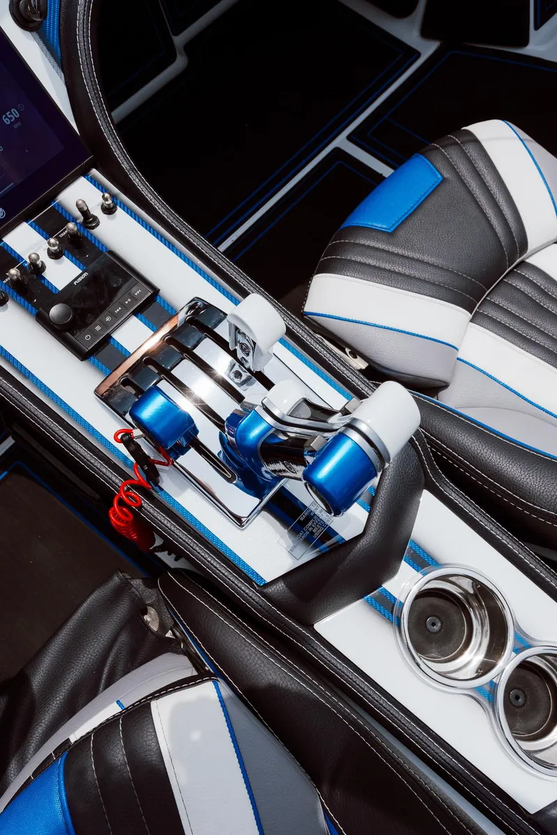 Slide: The Image of 2024 MTI 440X cockpit with sleek controls and blue-accented seats. - 43