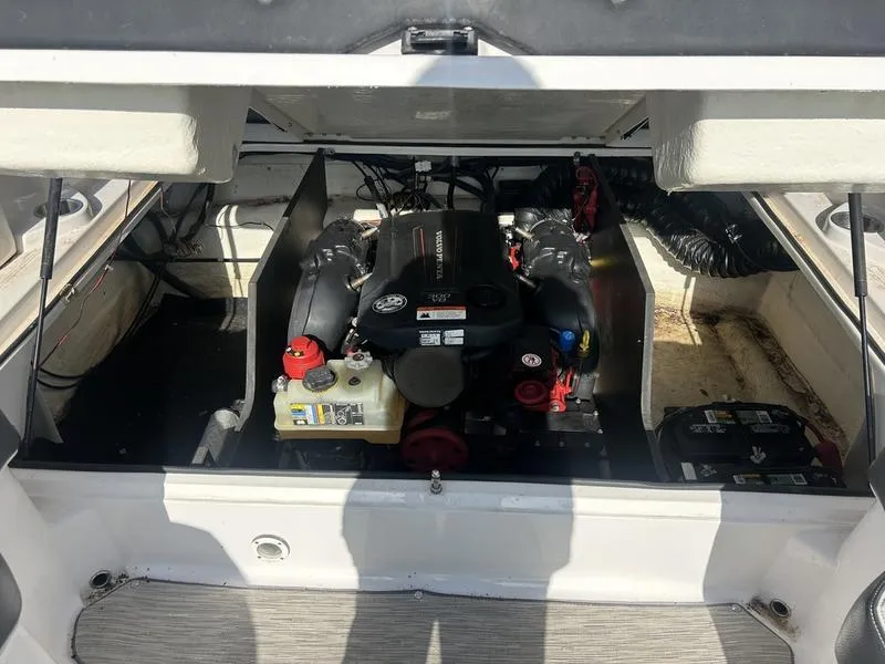 Slide: The Image of 2017 Regal 2300 Bowrider engine compartment with visible components and wiring. - 11
