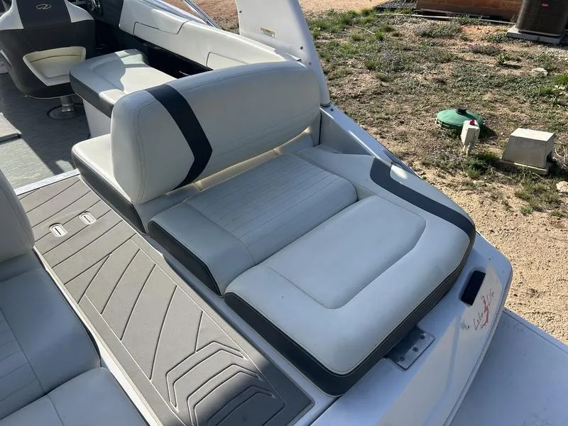 Slide: The Image of 2017 Regal 2300 Bowrider boat interior with white and gray seating. - 8