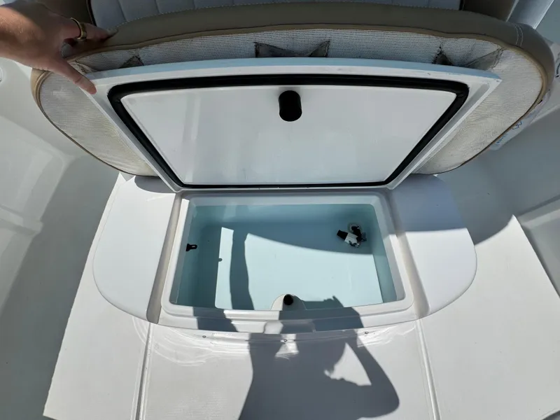 Slide: The Image of Open storage compartment on a 2015 Southport 29 FE boat. - 15