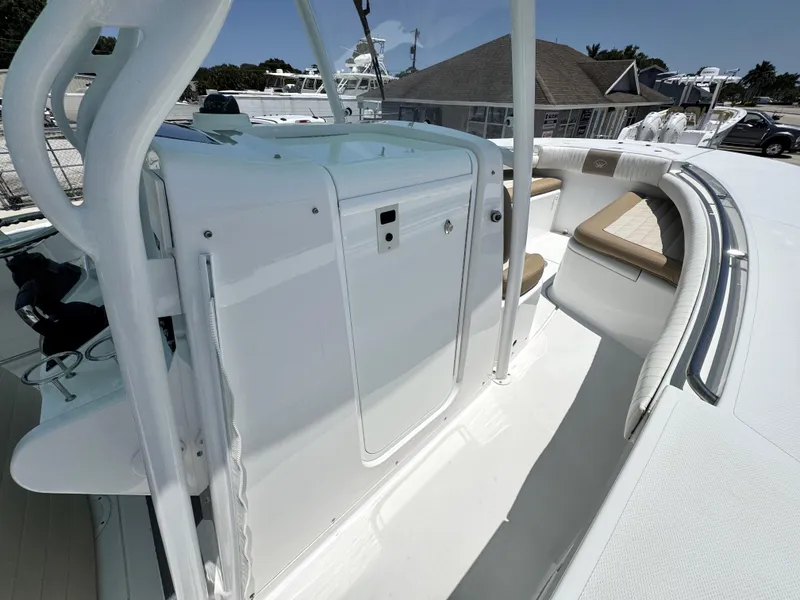 Slide: The Image of 2015 Southport 29 FE boat interior with seating and storage compartments. - 19