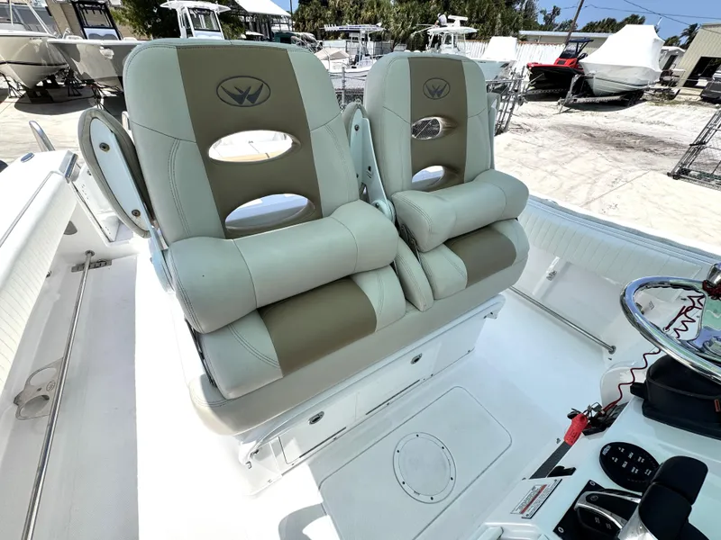 Slide: The Image of 2015 Southport 29 FE boat seats, featuring plush, dual-tone upholstery and modern design. - 26