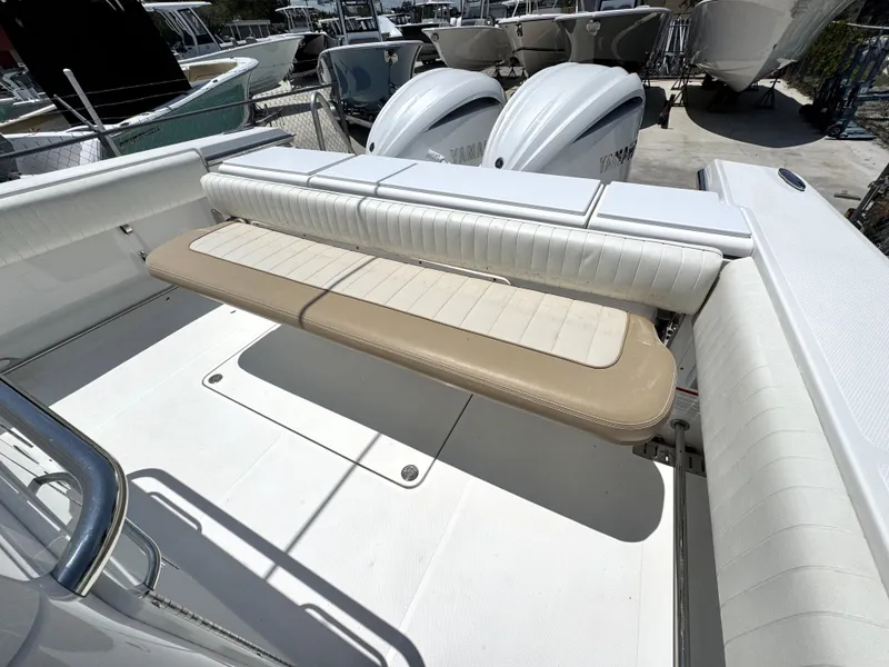 Slide: The Image of 2015 Southport 29 FE boat with foldable seating and dual outboard engines. - 33