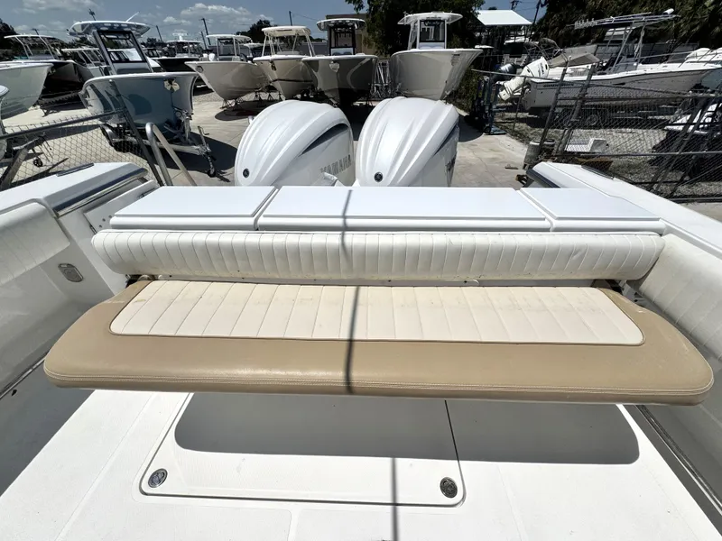 Slide: The Image of 2015 Southport 29 FE boat with cushioned seating and dual outboard motors. - 34
