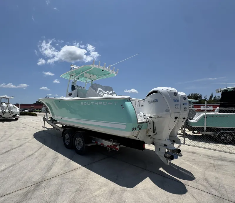 Slide: The Image of 2015 Southport 29 FE boat on trailer under clear blue sky. - 4