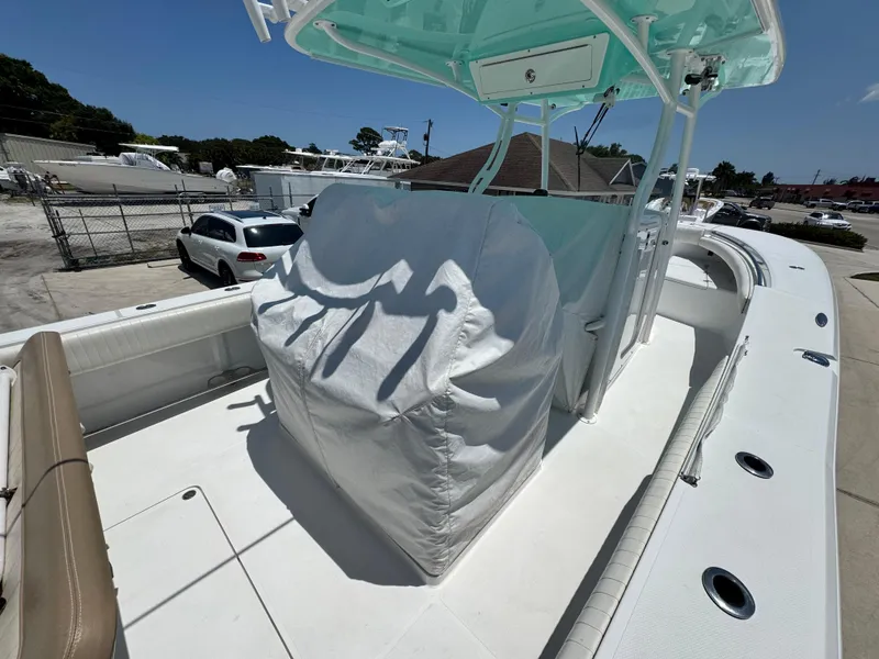 Slide: The Image of 2015 Southport 29 FE boat with covered console, docked in a marina. - 6