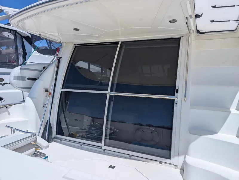 Slide: The Image of 2003 Cruisers Yachts 5000 Sport Sedan, rear view with sliding glass doors. - 15