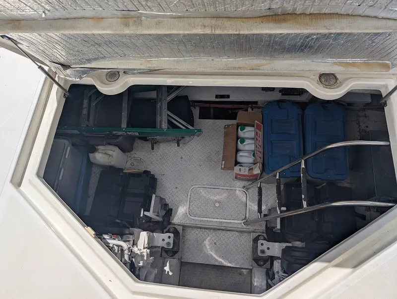 Slide: The Image of Engine compartment of 2003 Cruisers Yachts 5000 Sport Sedan with storage and equipment. - 16