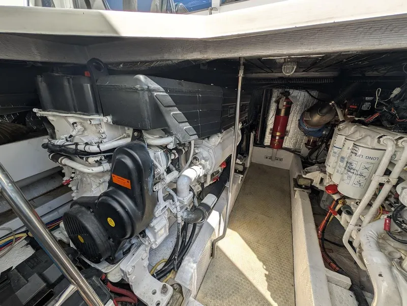 Slide: The Image of Engine room of 2003 Cruisers Yachts 5000 Sport Sedan, showcasing mechanical components and equipment. - 21