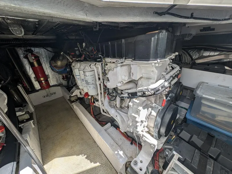 Slide: The Image of Engine room of a 2003 Cruisers Yachts 5000 Sport Sedan, showcasing mechanical components. - 22