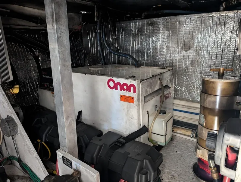 Slide: The Image of Engine room of 2003 Cruisers Yachts 5000 Sport Sedan with Onan generator. - 24