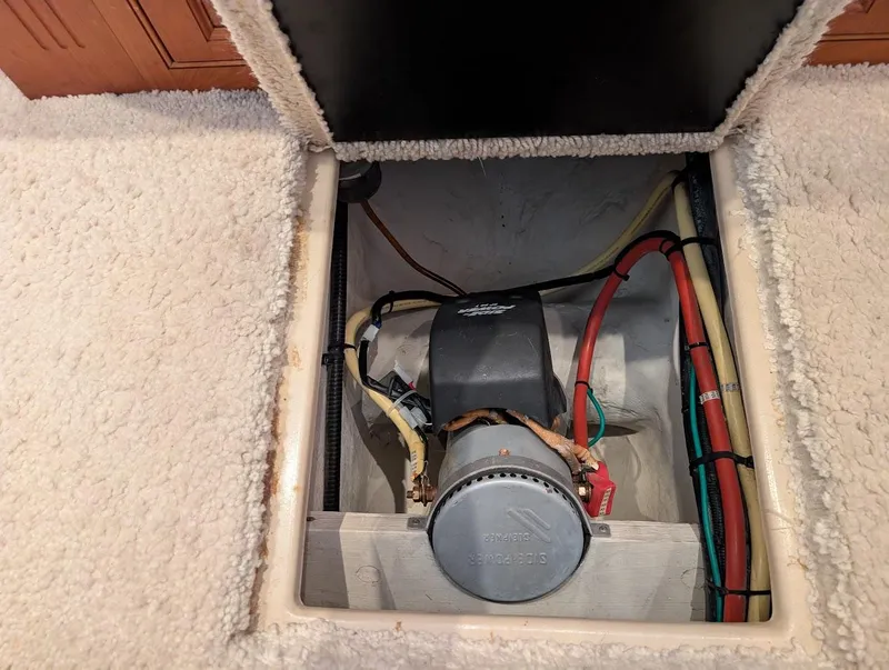 Slide: The Image of 2003 Cruisers Yachts 5000 Sport Sedan engine compartment with visible wiring and components. - 26