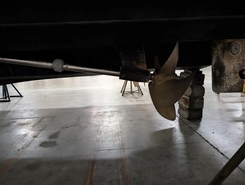 Slide: The Image of Propeller and shaft of 2003 Cruisers Yachts 5000 Sport Sedan in a workshop. - 30