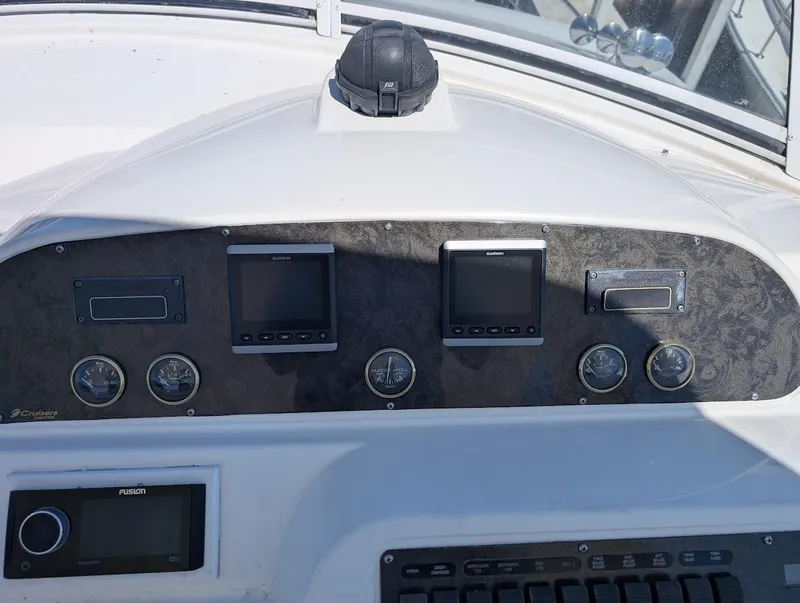 Slide: The Image of Dashboard of 2003 Cruisers Yachts 5000 Sport Sedan with navigation instruments. - 39