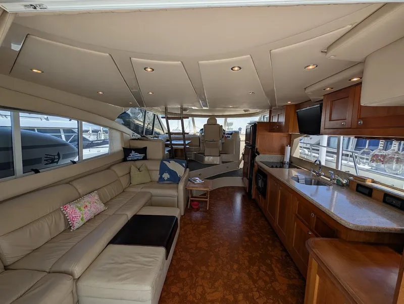 Slide: The Image of Luxurious interior of 2003 Cruisers Yachts 5000 Sport Sedan with modern amenities and seating. - 48