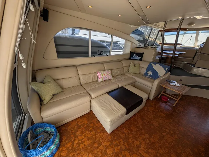 Slide: The Image of Luxurious interior of 2003 Cruisers Yachts 5000 Sport Sedan with beige leather seating. - 49