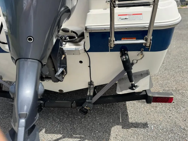 Slide: The Image of 2018 Wellcraft 182 Fisherman boat rear view with motor and ladder. - 5