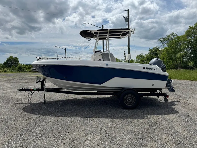 Slide: The Image of 2018 Wellcraft 182 Fisherman boat on trailer under cloudy sky. - 6