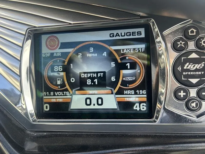 Slide: The Image of Dashboard of 2012 Tigé RZ2 boat showing gauges and digital display. - 3