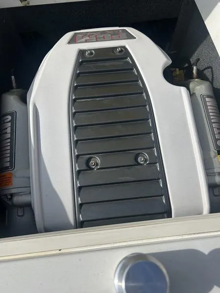 Slide: The Image of 2012 Tigé RZ2 engine compartment with visible components and detailing. - 4