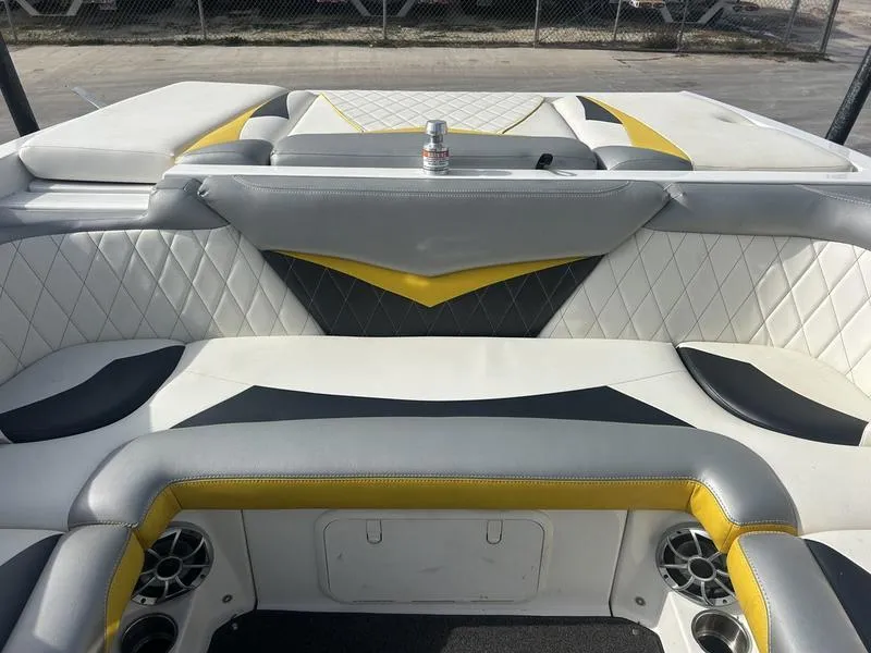 Slide: The Image of 2012 Tigé RZ2 boat interior with stylish gray and yellow seating design. - 6