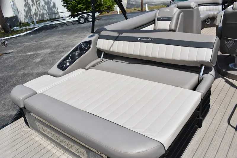 Slide: The Image of 2018 Bennington 23 GSB boat with beige and gray seating on deck. - 15