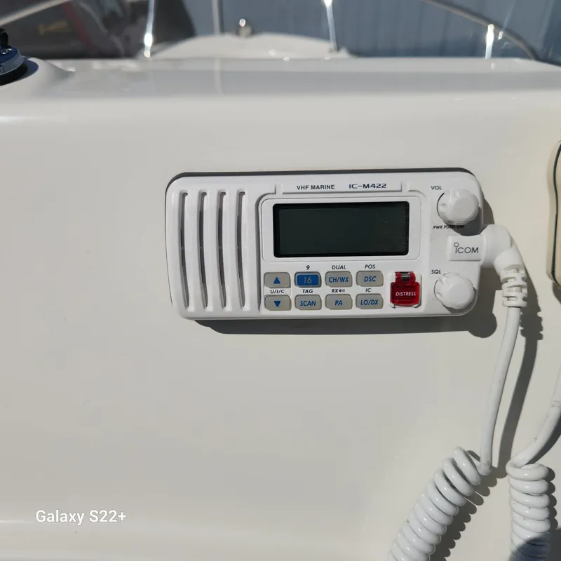 Slide: The Image of VHF marine radio on 2010 Boston Whaler 190 Outrage boat dashboard. - 15