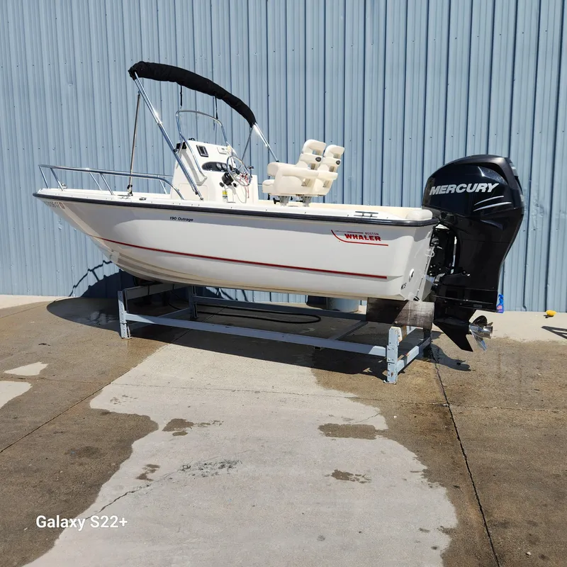 Slide: The Image of 2010 Boston Whaler 190 Outrage boat with Mercury engine on display. - 4