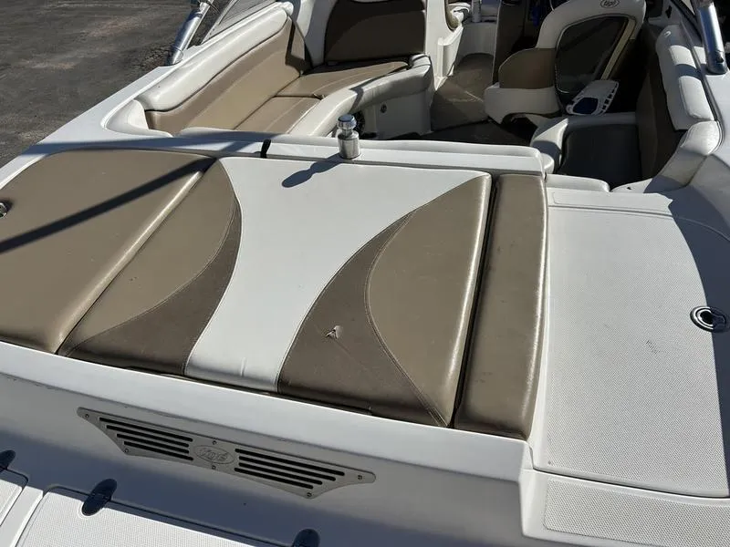 Slide: The Image of 2007 Tigé 22Ve boat interior with beige and white seating. - 2