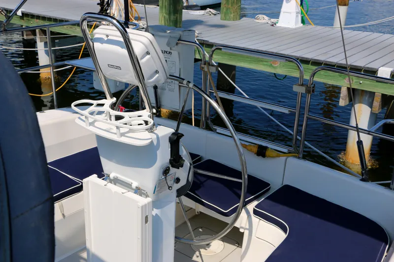 Slide: The Image of Cockpit of a 2006 Catalina 350 sailboat with steering wheel and seating. - 11