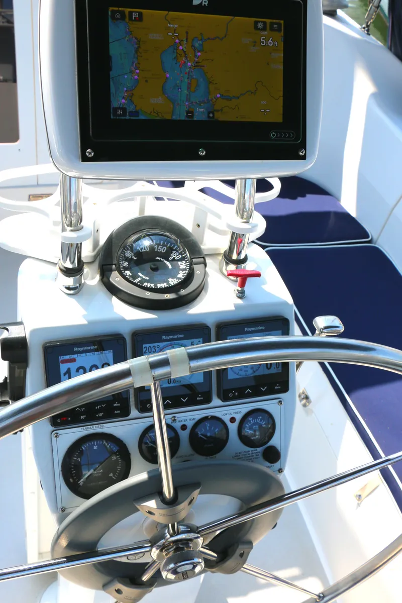 Slide: The Image of Steering console of a 2006 Catalina 350 sailboat with navigation instruments and GPS display. - 3