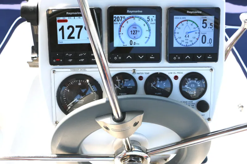 Slide: The Image of Steering console of a 2006 Catalina 350 sailboat with Raymarine navigation instruments. - 4