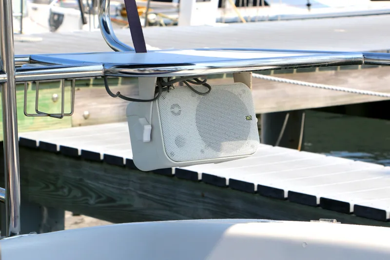 Slide: The Image of Outdoor speaker mounted on a 2006 Catalina 350 sailboat near a dock. - 7