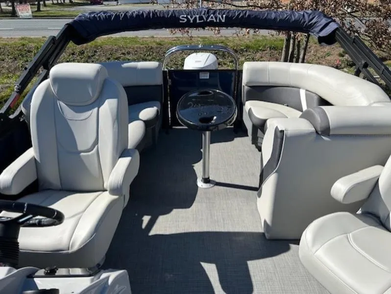 Slide: The Image of 2024 Sylvan Mirage X1 boat interior with plush seating and modern design. - 4