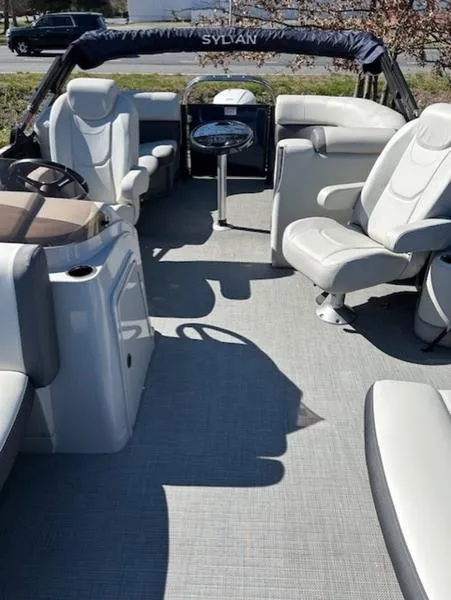 Slide: The Image of 2024 Sylvan Mirage X1 boat interior with plush seating and modern design. - 5