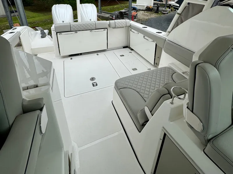 Slide: The Image of 2024 Pursuit DC 295 Dual Console boat interior with luxurious seating and modern design. - 22
