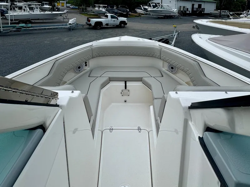 Slide: The Image of 2024 Pursuit DC 295 Dual Console boat interior with spacious seating and sleek design. - 8