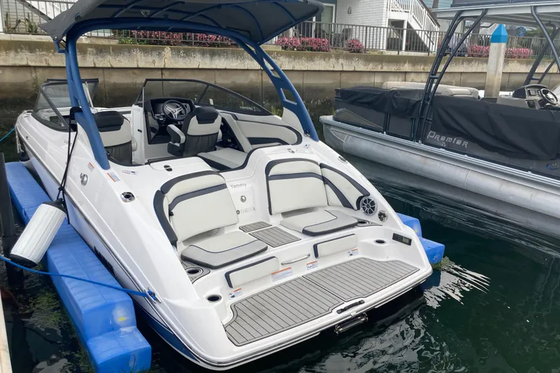Slide: The Image of 2020 Yamaha Boats AR242SE docked, featuring sleek design and spacious seating. - 3