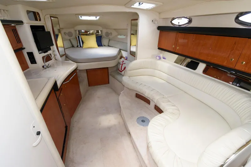 Slide: The Image of Luxurious interior of 2000 Sea Ray 340 Sundancer yacht with plush seating and modern amenities. - 11