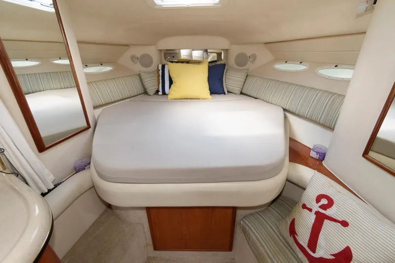 Slide: The Image of Cozy cabin interior of 2000 Sea Ray 340 Sundancer with bed and nautical decor. - 14