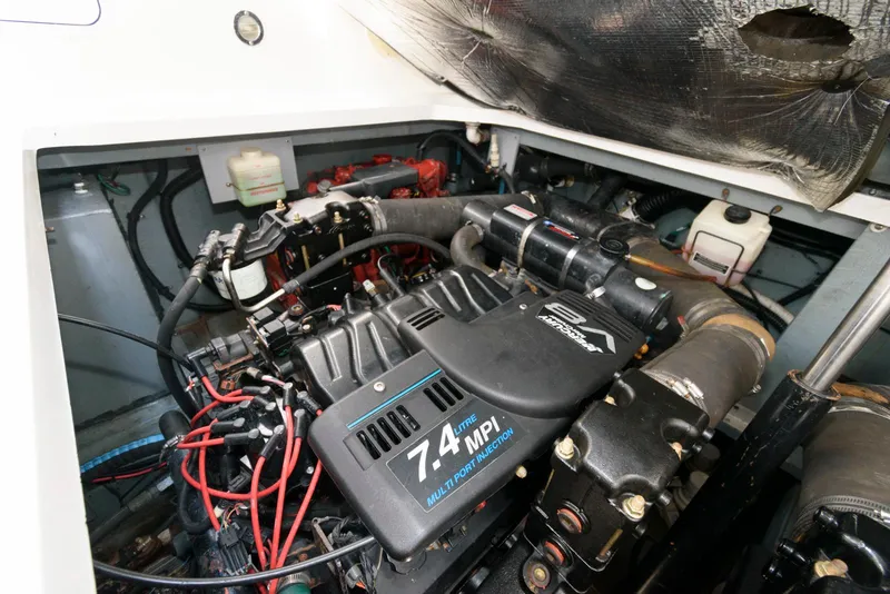 Slide: The Image of Engine compartment of a 2000 Sea Ray 340 Sundancer, featuring a 7.4L MPI engine. - 18