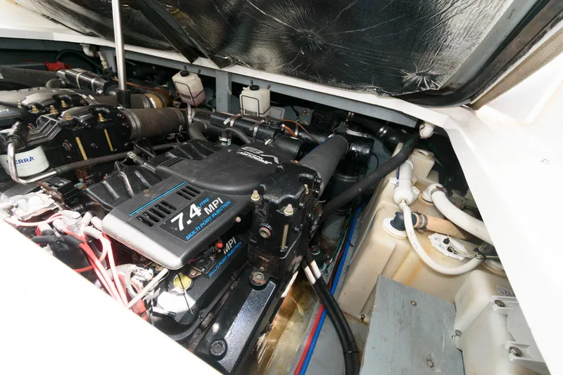 Slide: The Image of Engine compartment of a 2000 Sea Ray 340 Sundancer boat, featuring a 7.4 MPI engine. - 20