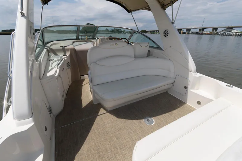 Slide: The Image of 2000 Sea Ray 340 Sundancer boat interior with white seating and open deck. - 6