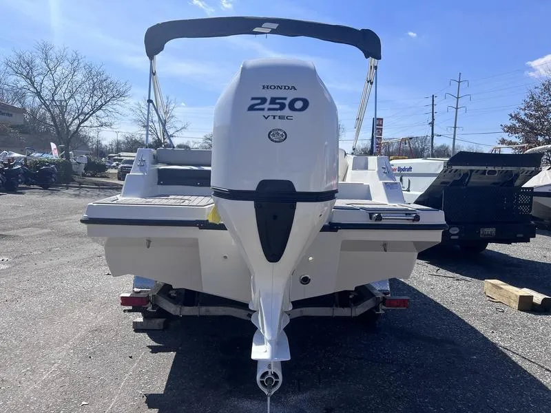 Slide: The Image of 2025 Starcraft SVX 231 OB boat with Honda 250 VTEC engine, rear view. - 7
