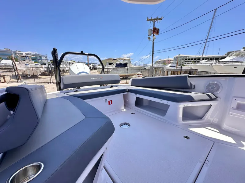 Slide: The Image of 2022 Axopar 22 T-Top boat interior with sleek seating and modern design. - 12