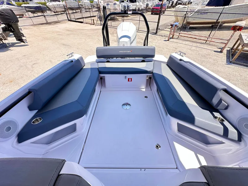 Slide: The Image of 2022 Axopar 22 T-Top boat interior with seating and storage compartments. - 13