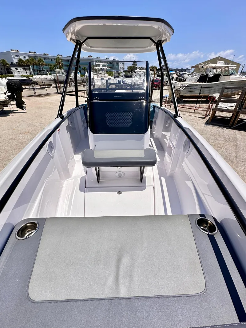 Slide: The Image of 2022 Axopar 22 T-Top boat with sleek design, spacious seating, and modern features. - 22