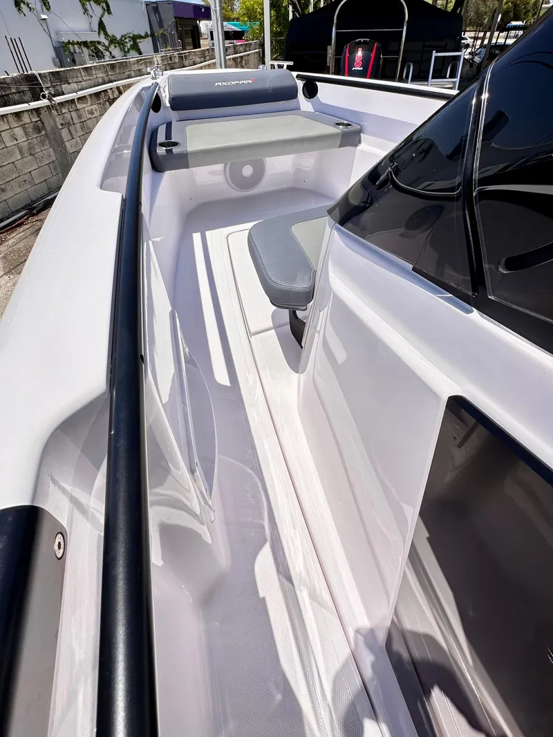 Slide: The Image of 2022 Axopar 22 T-Top boat, sleek design with comfortable seating and modern features. - 23