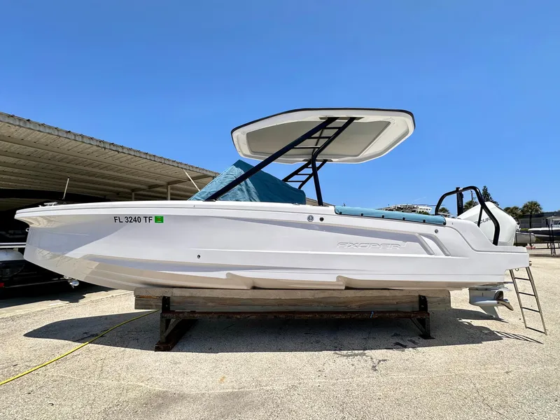 Slide: The Image of 2022 Axopar 22 T-Top boat on display, featuring sleek design and modern T-top canopy. - 4
